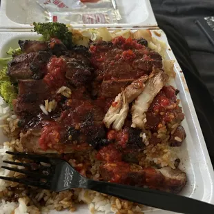 a fork and a fork in a styrofoam container