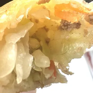 Black hair inside my egg roll. All tangled in the veggie.