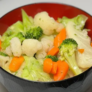 a bowl of broccoli and cauliflower