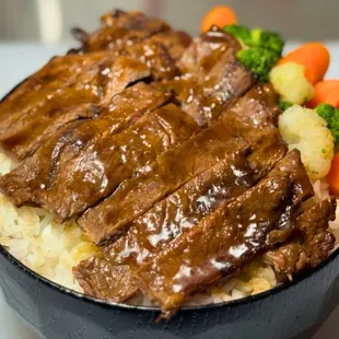 a bowl of beef and mashed potatoes