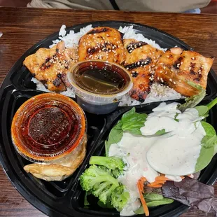 Grilled Salmon Sandwich Combo that comes with pot stickers and a drink