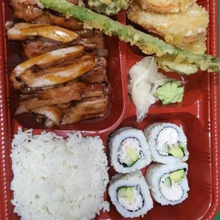 Delicious bento box with rice, California rolls, teriyaki chicken and veggie tempura! It&apos;s huge enough for two people!