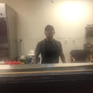 Unmasked cook,who posed for the picture.