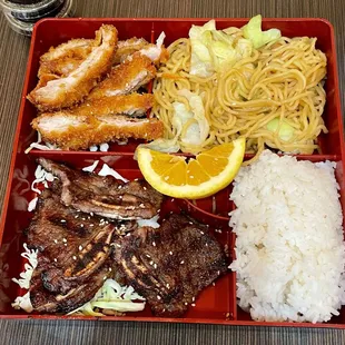 Sesame chicken, bbq short ribs, yakisoba noodles bento box