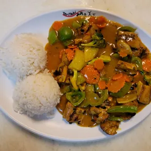 a plate of food with rice and vegetables
