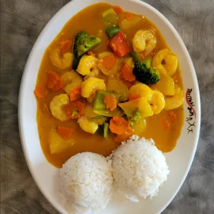 a plate of food with rice and vegetables