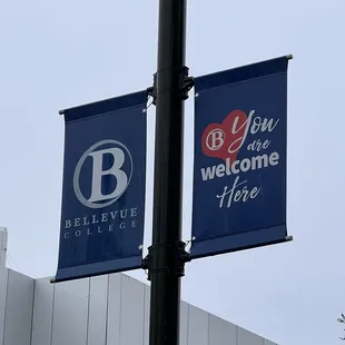 a blue and white welcome sign