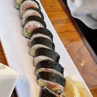 a plate of sushi rolls
