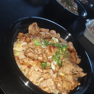 Teriyaki steak bowl with green onion on a bed of fried rice!