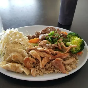 Chicken and steak plate with cabbage salad and gyoza.  Delish!!