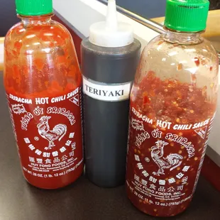 They have the holy trinity at every table.  Sriracha, chili paste and teriyaki sauce.  Mmmm...