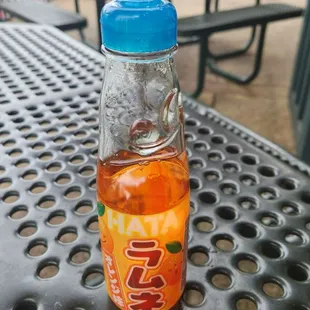 a bottle of soda on a table