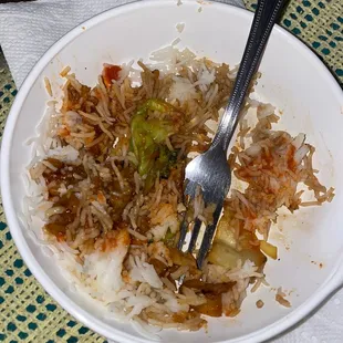 a fork in a bowl of rice