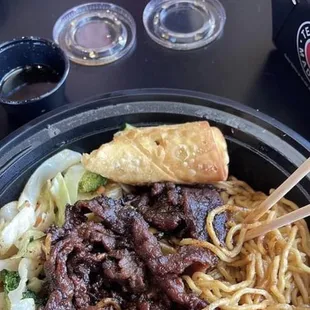 Steak Teriyaki Bowl with Yaki Soba and chicken egg roll!