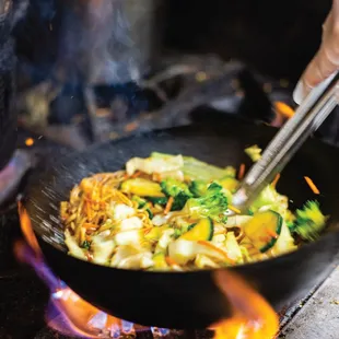a frying pan on a fire