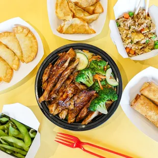 Chicken Teriyaki surrounded by Chicken Potstickers, Crab Rangood, Edamame, Chicken Eggroll, and Fried Rice