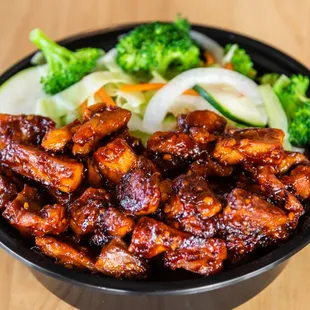 a bowl of chicken and broccoli