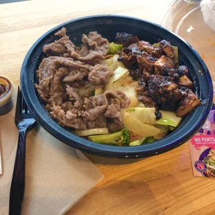 Spicy chicken and beef over stir-fry vegetables mmmmm What a great place, quick online ordering and fresh great tasting food.