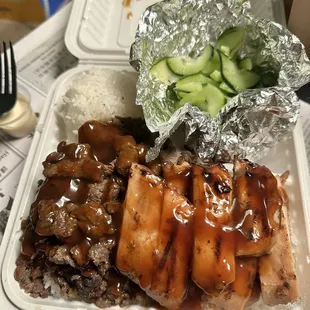 Chicken teriyaki and beef teriyaki with a side of cucumber salad