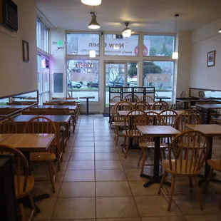 a restaurant with tables and chairs