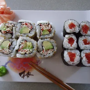 a plate of sushi and chopsticks