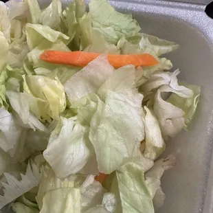 The salad is now in a smaller container and it is browning