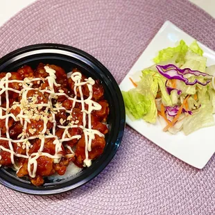 a plate of food and a salad