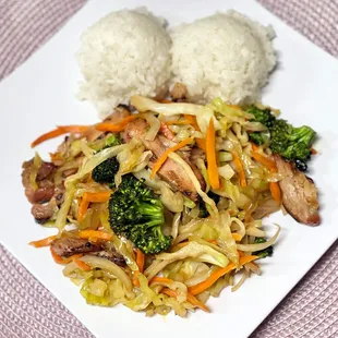 a plate of food with rice and vegetables