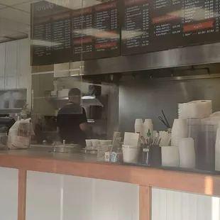 a man standing behind a counter