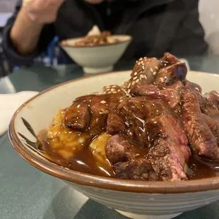 Beef teriyaki bowl with sesame seeds.