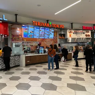 people standing in line to order food