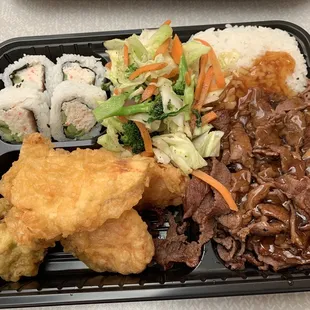 a tray of asian food