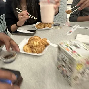 a group of people eating at a restaurant
