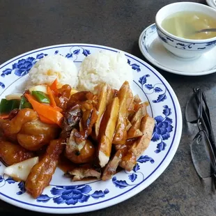 Teriyaki chicken and Sweet and Sour chicken lunch special with soup (not sure, is that sliced asian radish in there?)
