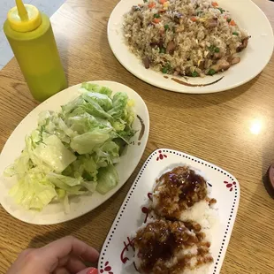 Chicken fried rice with a side of simple rice and salad