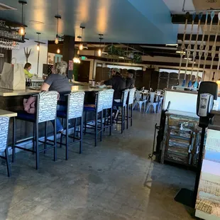 View of bar and dining area from front door