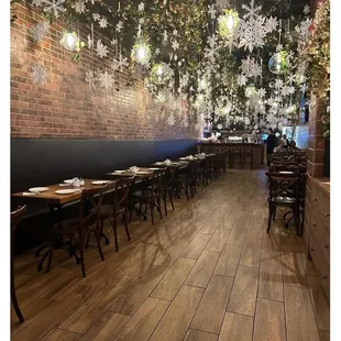 the dining area with snowflakes hanging from the ceiling