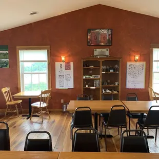 a dining room with tables and chairs