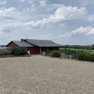 a red barn with a black roof