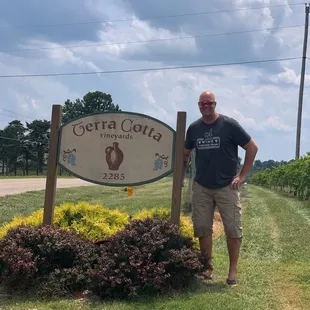 Me in front of the winery sign posing.