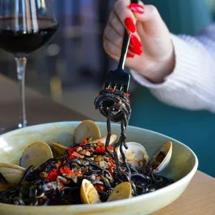 a bowl of pasta with clams