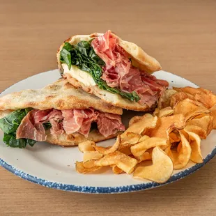 a sandwich and chips on a plate