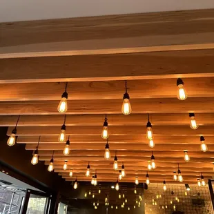 a wooden ceiling with light bulbs
