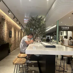 Counter sitting by olive tree