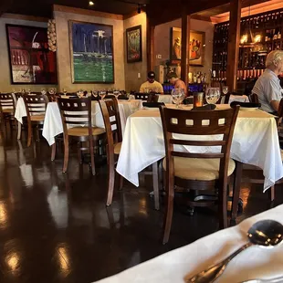 the dining area with tables and chairs