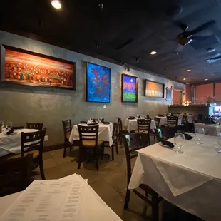 Inside view of restaurant. This is one of the areas with traditional table setup. The other side has wine racks and booths.