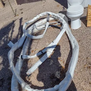 The damaged tubing supposed to transmit air from condenser to unit.