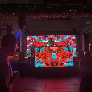 people watching a video screen