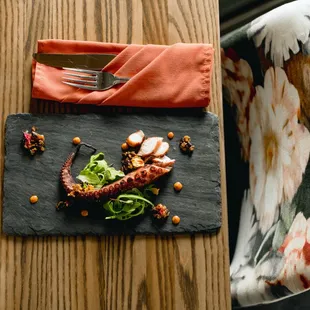 Sous Vide Spanish Octopus, Fermented Black Bean Pear Reduction, Red Pepper Couli, Micro Salad, Shaved Fennel