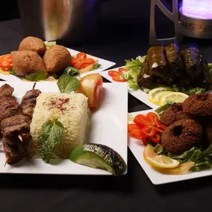 four plates of food on a table